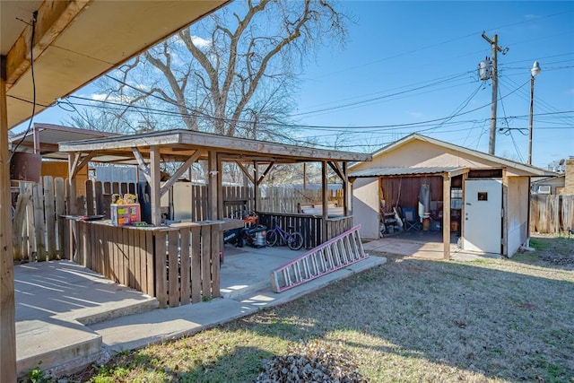 view of yard featuring a storage unit and a patio area