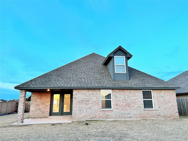 rear view of property featuring a patio area