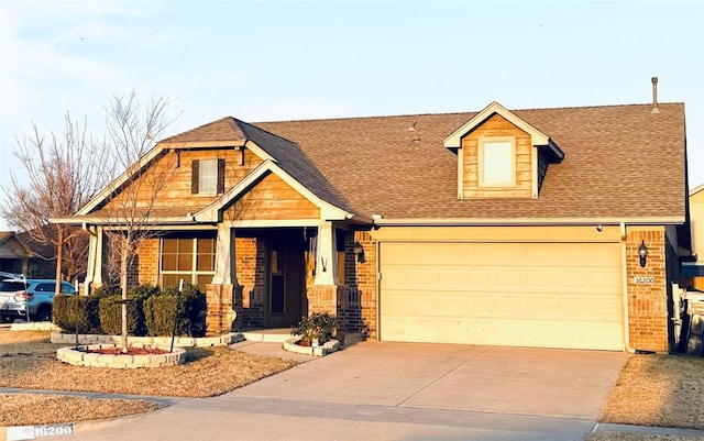 view of front of house featuring brick siding, roof with shingles, concrete driveway, and an attached garage