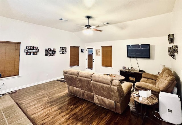 living room with visible vents, baseboards, lofted ceiling, wood finished floors, and a ceiling fan