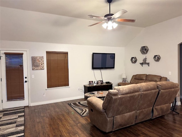 living area with lofted ceiling, wood finished floors, baseboards, and ceiling fan