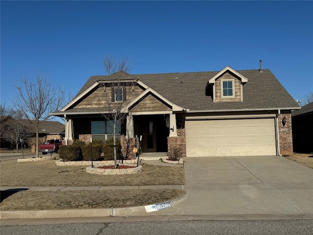 view of front of house with concrete driveway, a garage, brick siding, and a shingled roof