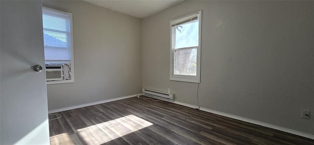 empty room with a baseboard radiator, cooling unit, and dark hardwood / wood-style flooring