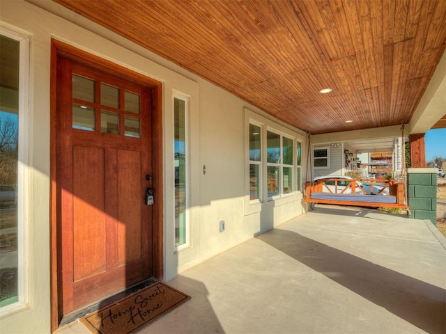 property entrance featuring covered porch