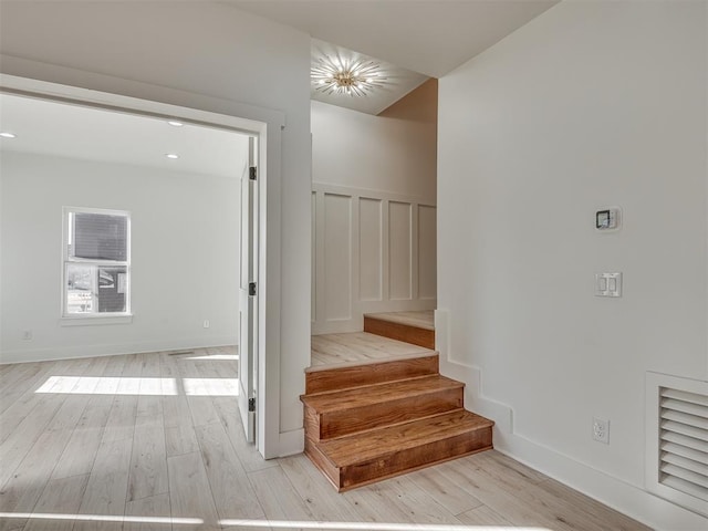 stairs with wood-type flooring