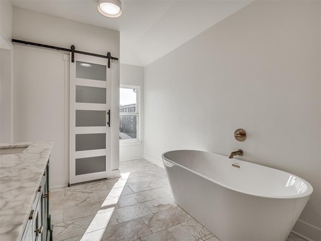 bathroom featuring vanity and a tub to relax in