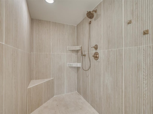 bathroom with tiled shower