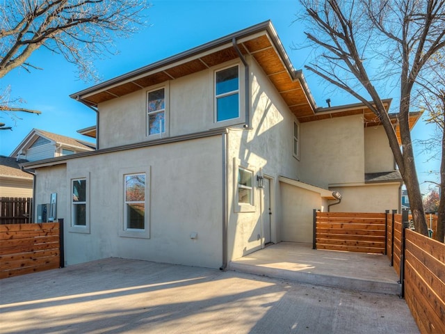 rear view of house featuring a patio