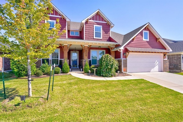 craftsman-style home with a front yard, a garage, and covered porch