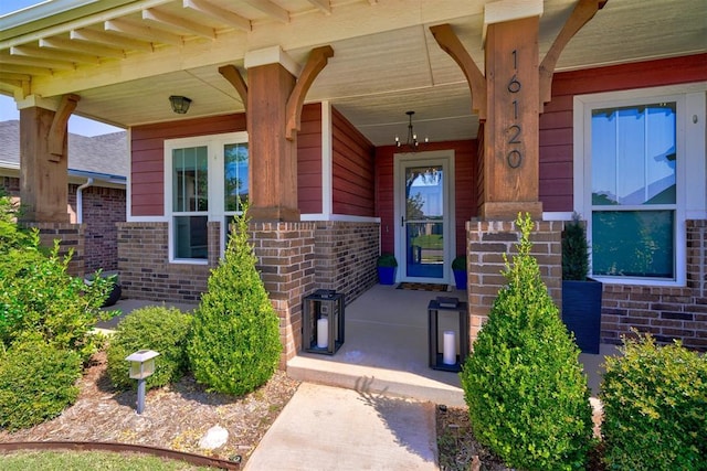 doorway to property featuring covered porch