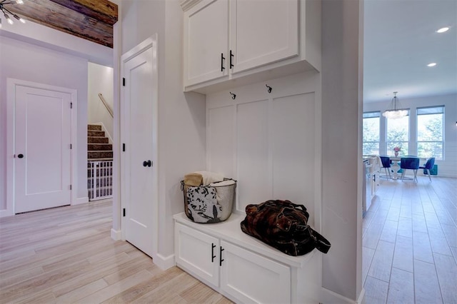 mudroom with light hardwood / wood-style flooring