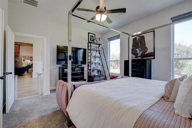 bedroom with light colored carpet and ceiling fan