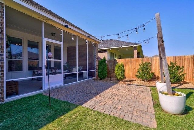 exterior space featuring a patio and a sunroom