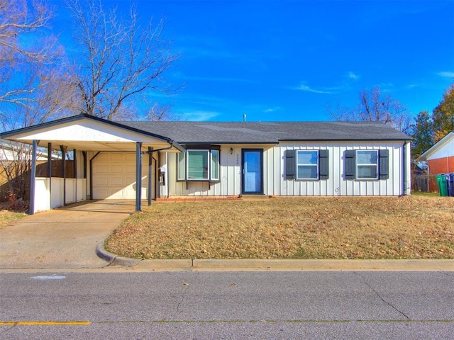 single story home featuring a garage and a carport