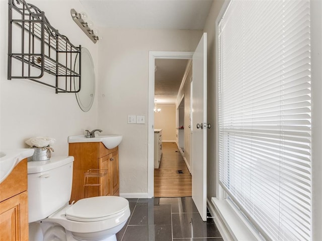 bathroom with hardwood / wood-style flooring, vanity, and toilet