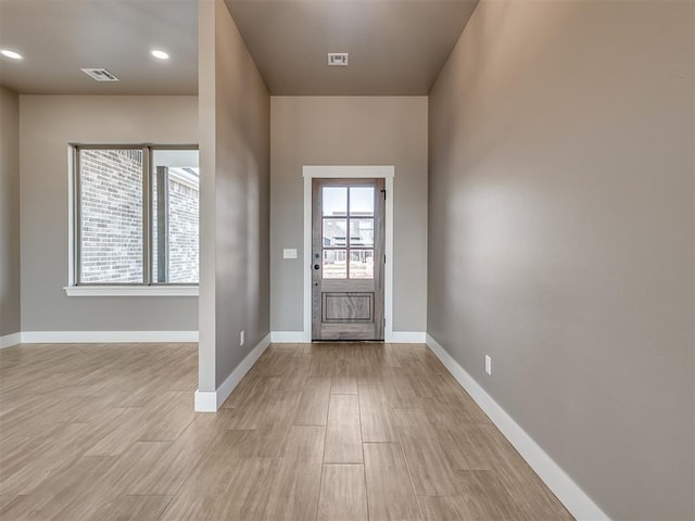 entrance foyer featuring a healthy amount of sunlight and light hardwood / wood-style flooring