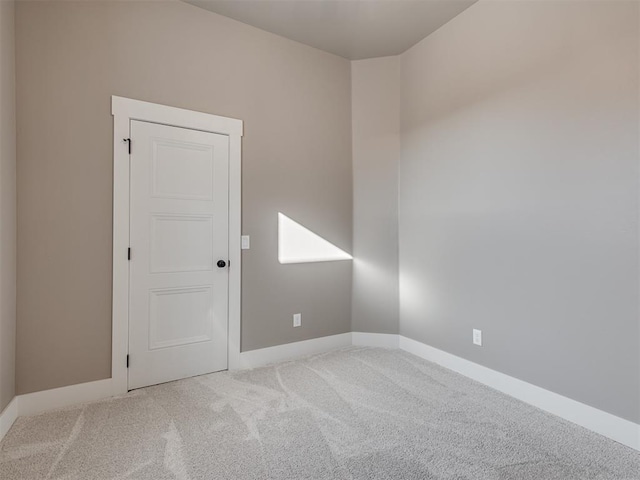 unfurnished room featuring carpet