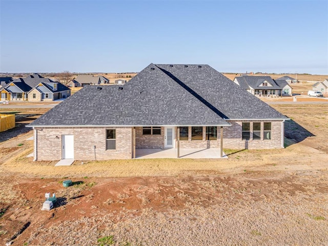 rear view of house featuring a patio