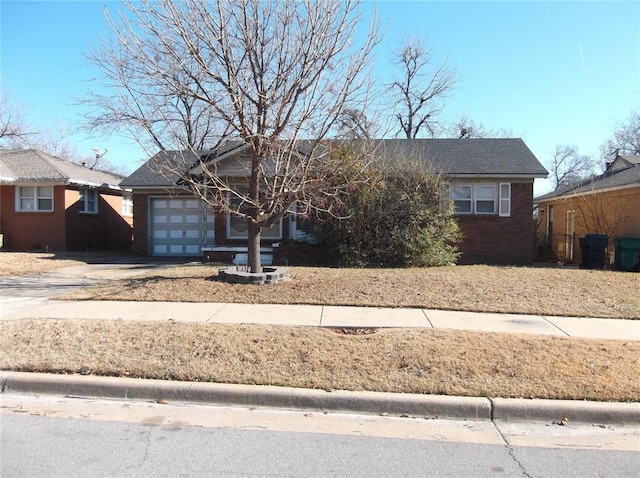 single story home featuring a garage