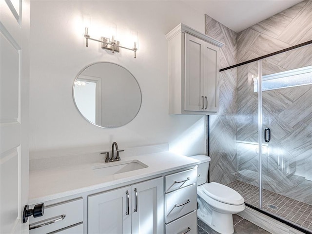 bathroom featuring toilet, vanity, tile patterned floors, and walk in shower