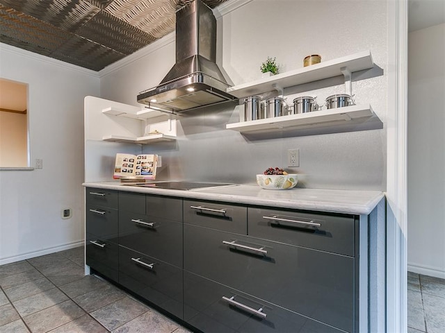 kitchen with black electric stovetop, ornamental molding, and island exhaust hood