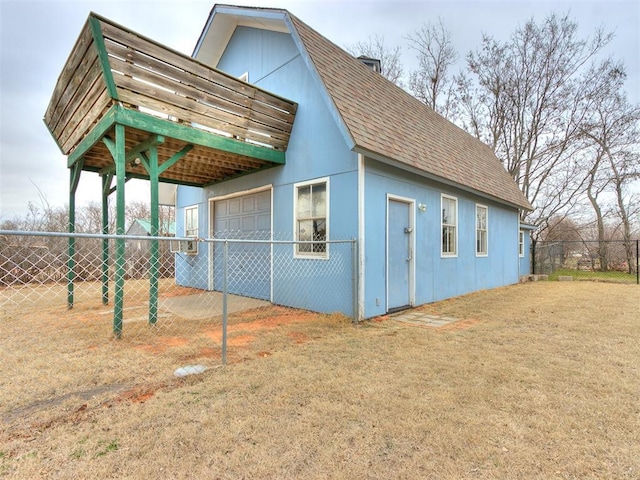 view of outdoor structure featuring a yard and a garage