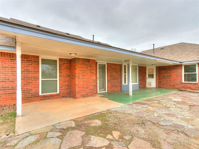 rear view of house with a patio