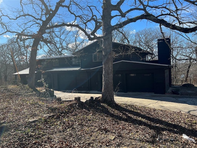 view of side of home with a garage