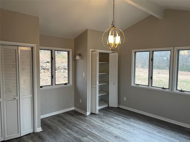 unfurnished bedroom with vaulted ceiling with beams, dark wood-type flooring, and a chandelier