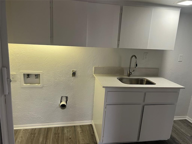 laundry area with sink, cabinets, electric dryer hookup, dark hardwood / wood-style floors, and hookup for a washing machine