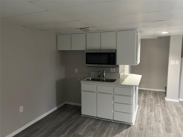 kitchen with white cabinetry, ceiling fan, dark wood-type flooring, and sink