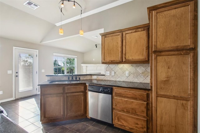 kitchen with dishwasher, sink, dark tile patterned floors, kitchen peninsula, and lofted ceiling