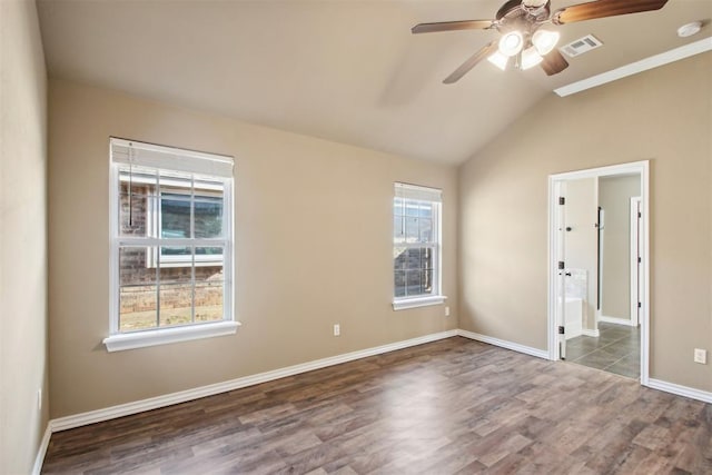 unfurnished bedroom featuring ceiling fan, dark hardwood / wood-style flooring, and lofted ceiling