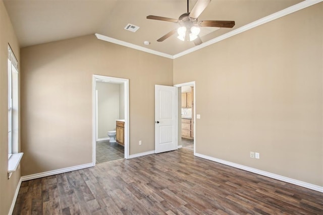 unfurnished bedroom with dark hardwood / wood-style flooring, ensuite bathroom, ornamental molding, vaulted ceiling, and ceiling fan