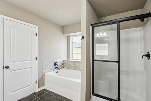 bathroom featuring tile patterned flooring and separate shower and tub