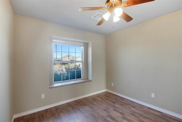 unfurnished room featuring hardwood / wood-style flooring and ceiling fan