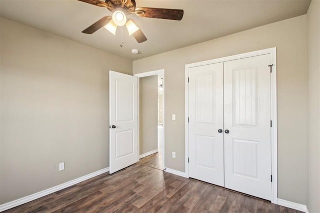 unfurnished bedroom featuring ceiling fan, a closet, and dark hardwood / wood-style floors