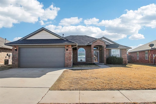 ranch-style home featuring a garage and central AC