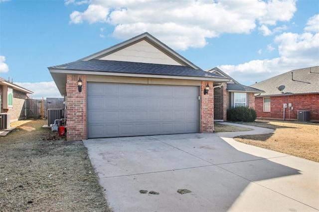 single story home featuring central AC and a garage