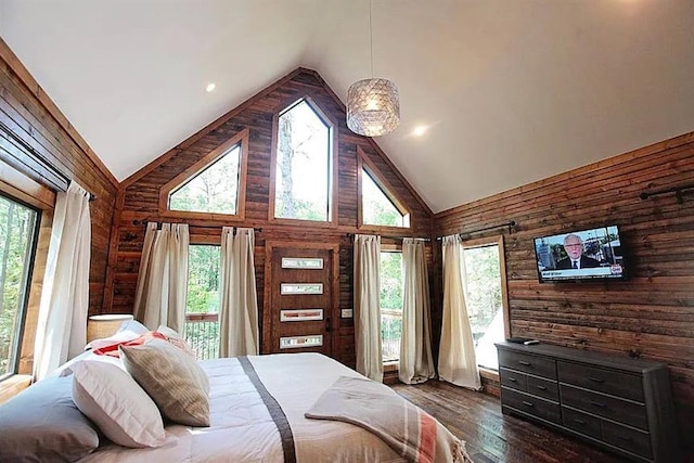 bedroom featuring wood walls, dark hardwood / wood-style flooring, and high vaulted ceiling