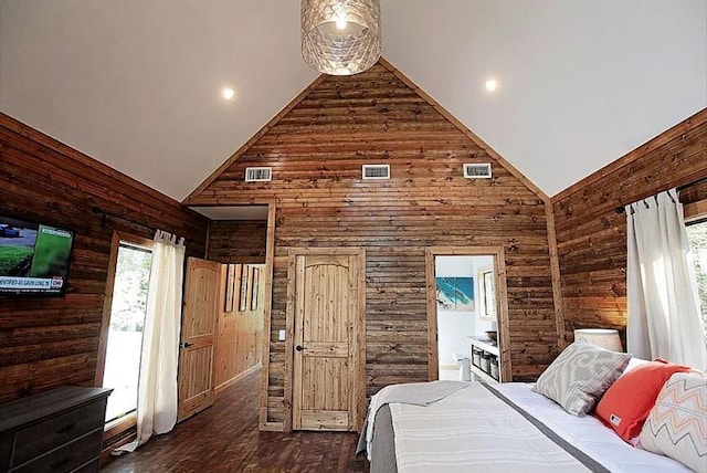 bedroom featuring dark hardwood / wood-style flooring, high vaulted ceiling, and wooden walls