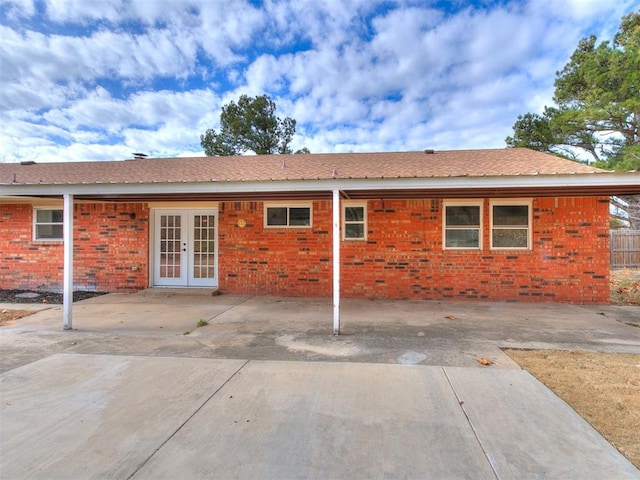 rear view of house featuring french doors