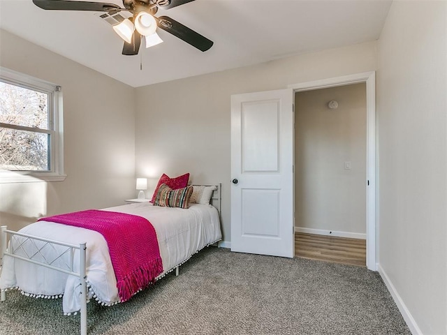 carpeted bedroom featuring ceiling fan