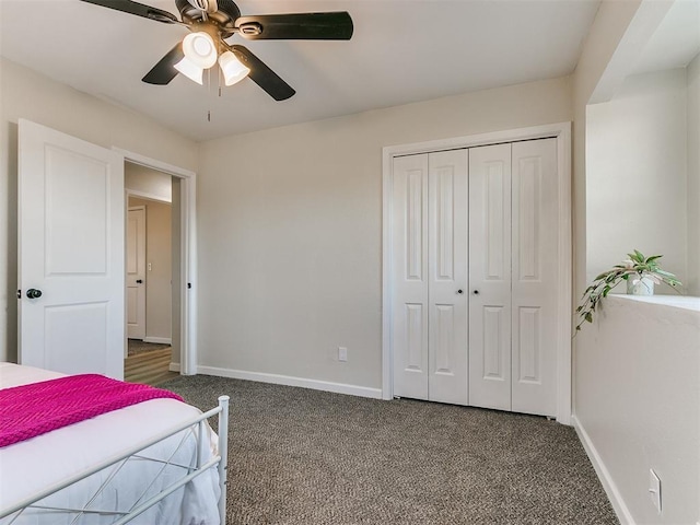 bedroom featuring dark colored carpet, a closet, and ceiling fan