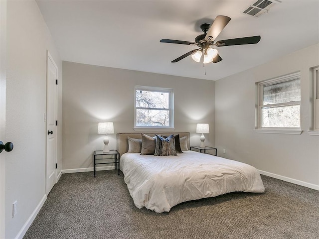 bedroom featuring ceiling fan and carpet