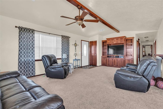 living room with a textured ceiling, lofted ceiling with beams, carpet floors, and ceiling fan