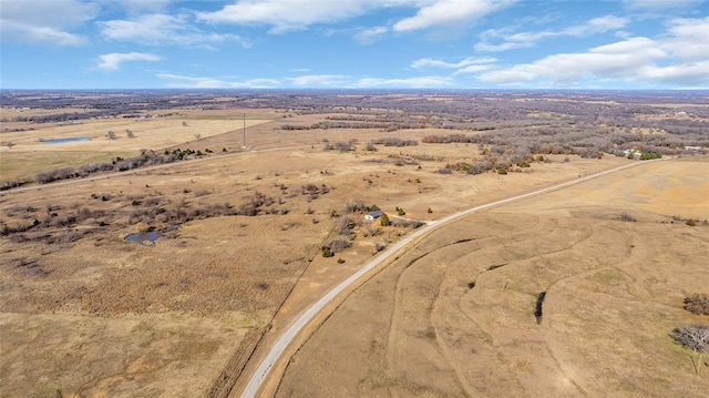 birds eye view of property featuring a rural view