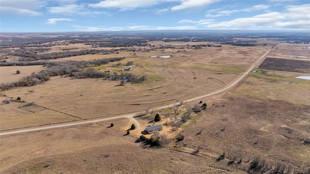 birds eye view of property featuring a rural view