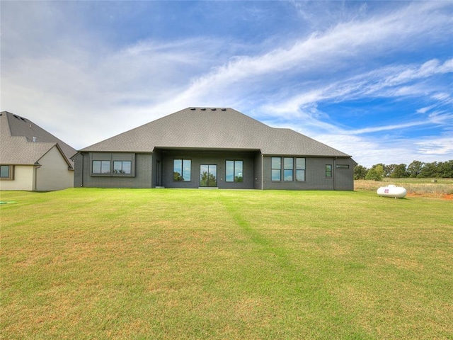 back of house featuring a lawn