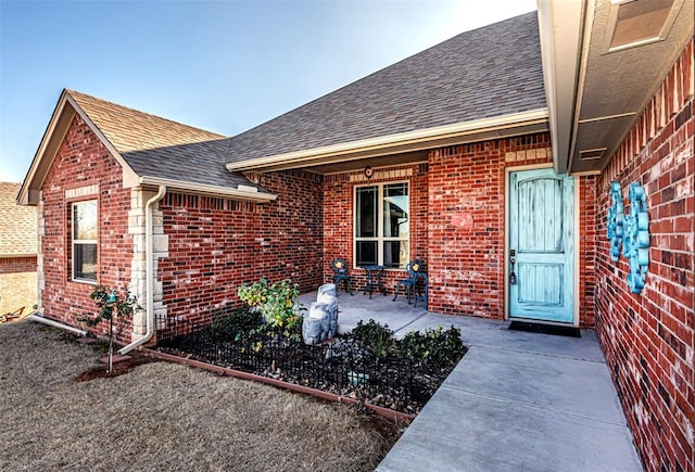 property entrance with a patio